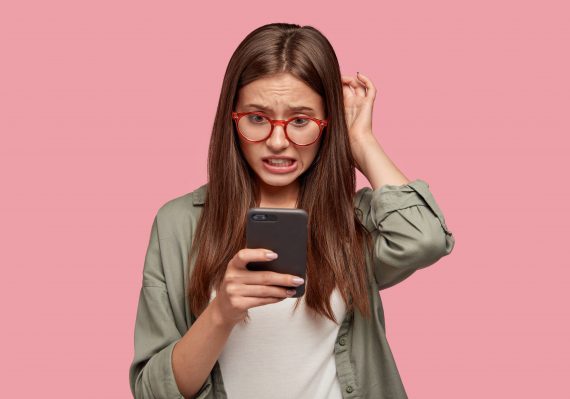 Fake News- girl reading phone