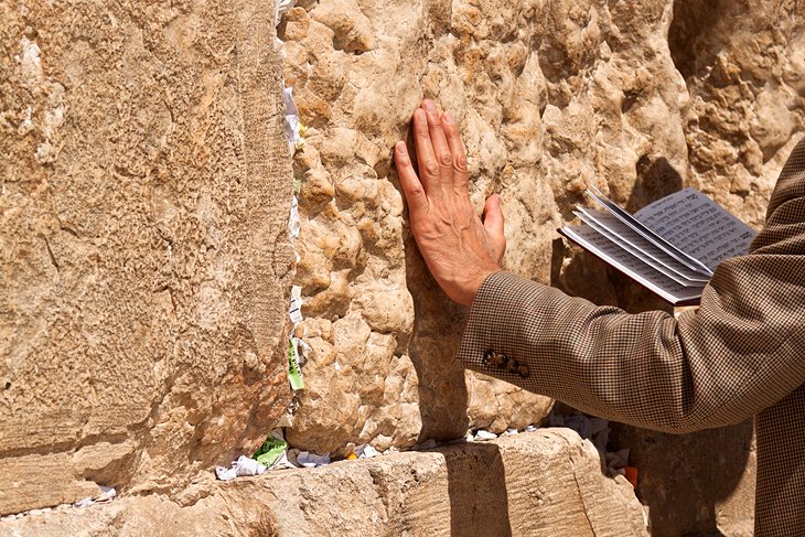 Hand placed upon Western Wall in Prayer